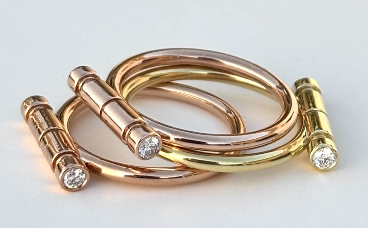 The Bar rings in 18K yellow and rose gold